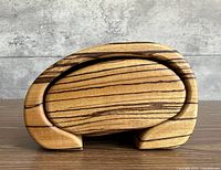 Front view of curved zebrawood box showing grain