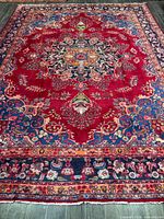 Full view of handmade Persian Mashhad wool rug