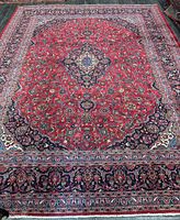 Full view of rug showing entire pattern and borders