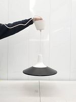 Full view of pendant lamp hanging, showing shade, neck, cord and ceiling cup