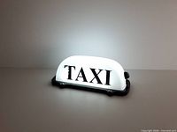 Front view illuminated showing TAXI text and overall form