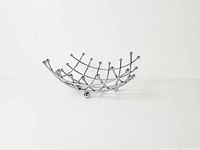 Full view of chrome grid basket on white background