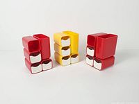 Front view of three stacked organizers showing colour and design