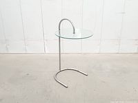 Full view of side table showing chrome frame and glass top