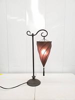 Full front view showing stand, shade illuminated