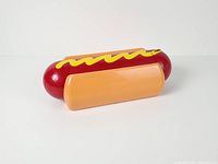 Full view of closed condiment holder from side