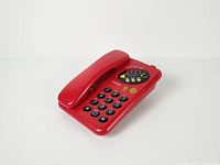 Top view of red Youmax Relax's phone showing keypad and handset