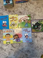 All seven French children’s books laid out
