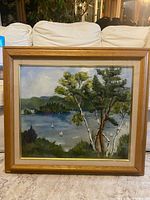 Full view of framed landscape painting