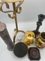 Group view of all candleholders, incense burner, stand
