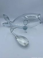 Blenko fish vase and solid glass whale side by side