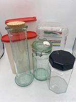 Group shot of all six containers displaying sizes, materials and lids