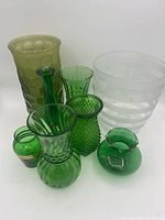 Group shot showing all eight glass pieces front and back