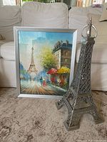 Painting and Eiffel Tower sculpture together for scale reference