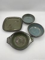 All four stoneware pieces grouped