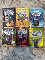 Front covers of all six Upside-Down Magic books displayed