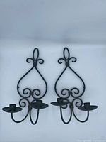 Front view of both matching metal wall sconces