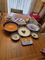 All ten ceramic pieces on table