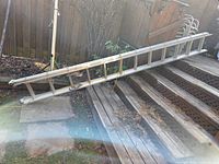 Full view of extended ladder on outdoor stairs