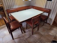 Full view of banquette set with table and chairs
