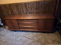 Front view showing full teak credenza with drawers and doors