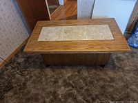 Top view showing wood surface with three ceramic tile panels