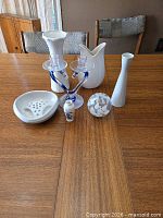 All seven decorative items grouped on table