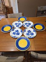 All eight plates arranged on table