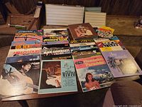 Overall view of LPs and 45s spread on table