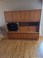 Front view of teak china hutch fully closed