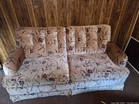 Front view of floral hide-a-bed sofa