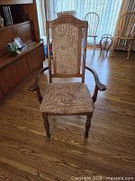 Front view of oak armchair