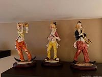 All three resin clown figurines on display