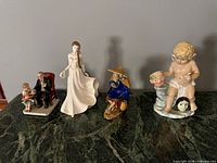 All four figurines side by side