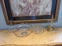 All four glass pieces displayed together on surface