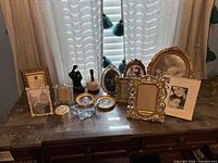 All seven frames on tabletop showing variety of styles and sizes