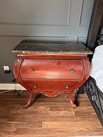 Front three-quarter view showing overall form and marble top