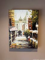 Front view of the Village II canvas hanging on wall