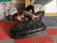 Full view of bronze-style horse sculpture front left