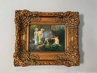 Front view showing full ornate gilt frame and painting