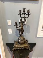 Full view of figural candelabra front