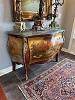 Front left perspective showing painted scene, marble top, ormolu mounts