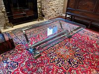 Oblique view showing glass thickness, metal support bar and feet