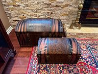 Both trunks side by side showing size difference and exterior finish