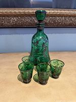 Full view of decanter with stopper and five glasses