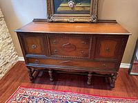 Front view showing overall design, drawers, doors, legs