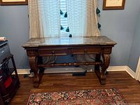 Front view of entire console table showing drawers, legs and faux marble top