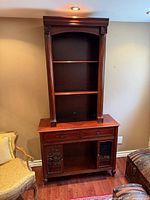 Full view of cabinet showing upper shelves and lower storage