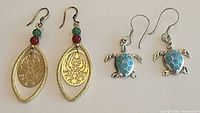 Both pairs of earrings side by side showing overall design and size