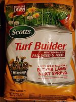 Front of Scotts Turf Builder WinterGuard Fall Weed & Feed bag showing branding and product claims